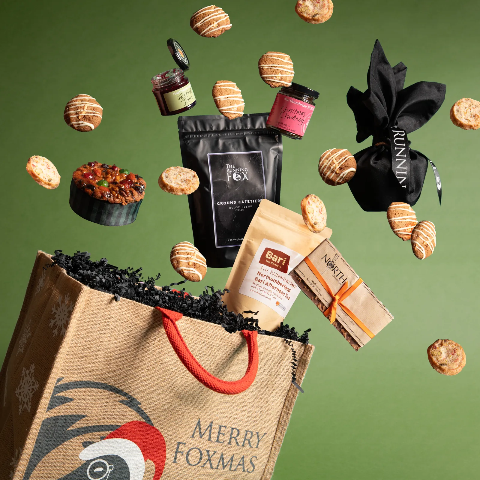 A Foxmas Tale gift bag with Christmas treats bursting out