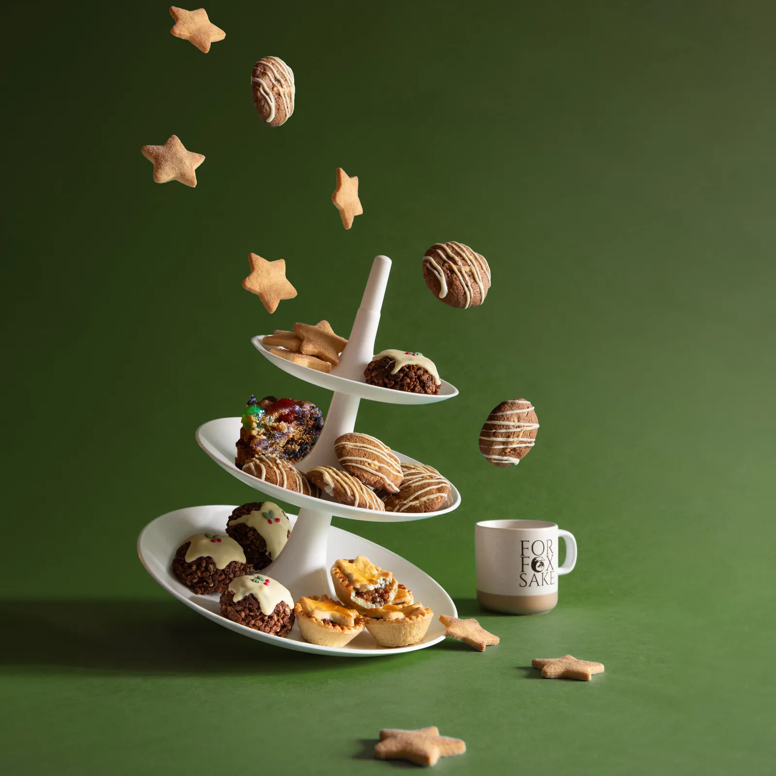Foxy Christmas treats on a tiered stand with shortbread stars