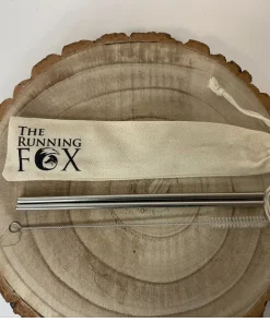 The Running Fox Metal Straws in Pouch on Wooden Block