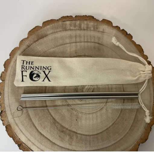 The Running Fox Metal Straws in Pouch on Wooden Block