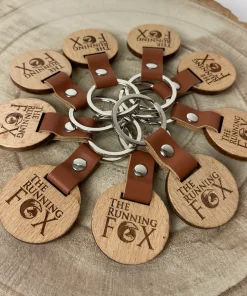 The Running Fox Wood Keyrings with Leather Handle in a Circle Pattern