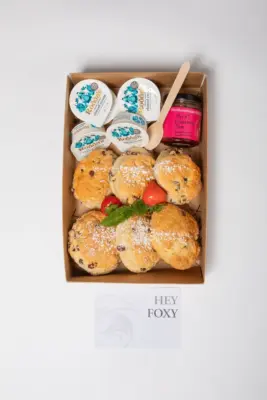 Sweet scones with clotted cream and jam