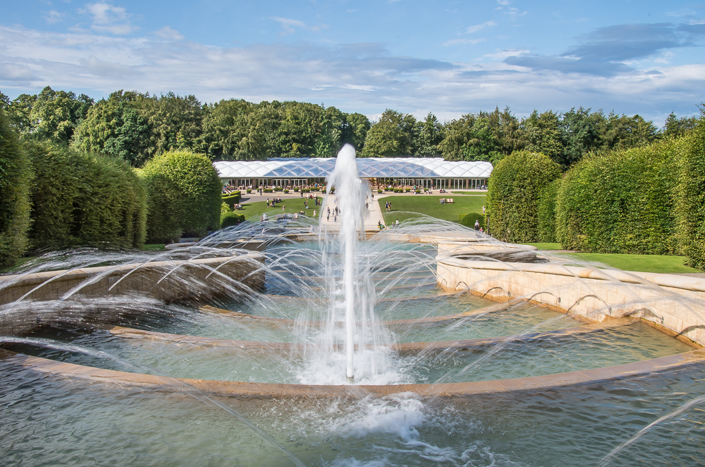 The Grand Cascade water feature at The Alnwick Garden on a bright summer day